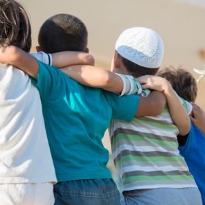 muslim boys holding each other