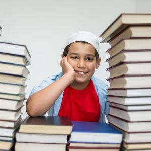 muslim boy with books