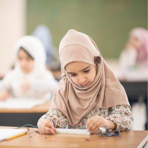young muslim girl studiying